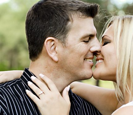 A couple initiating a kiss.