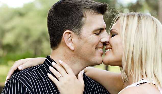 A couple initiating a kiss.