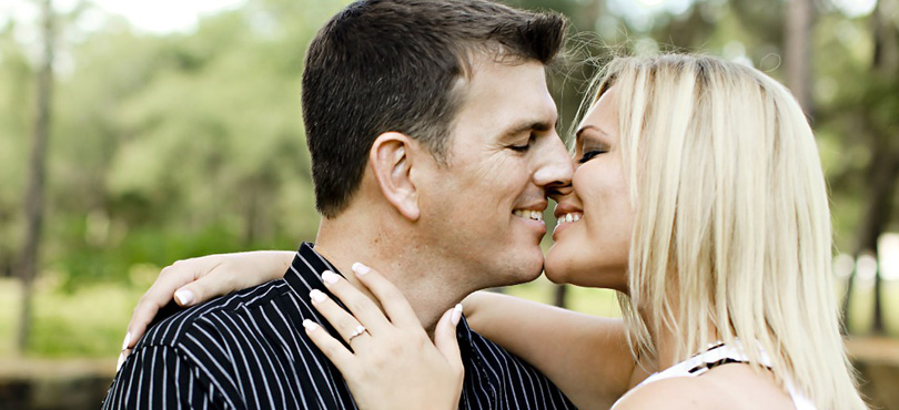 A couple initiating a kiss.