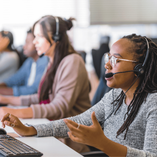 A customer service team works on their laptop while resolving customer complaints.