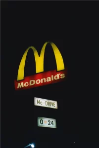 Image displaying the iconic golden arches logo of McDonald's, the globally recognized fast-food chain.