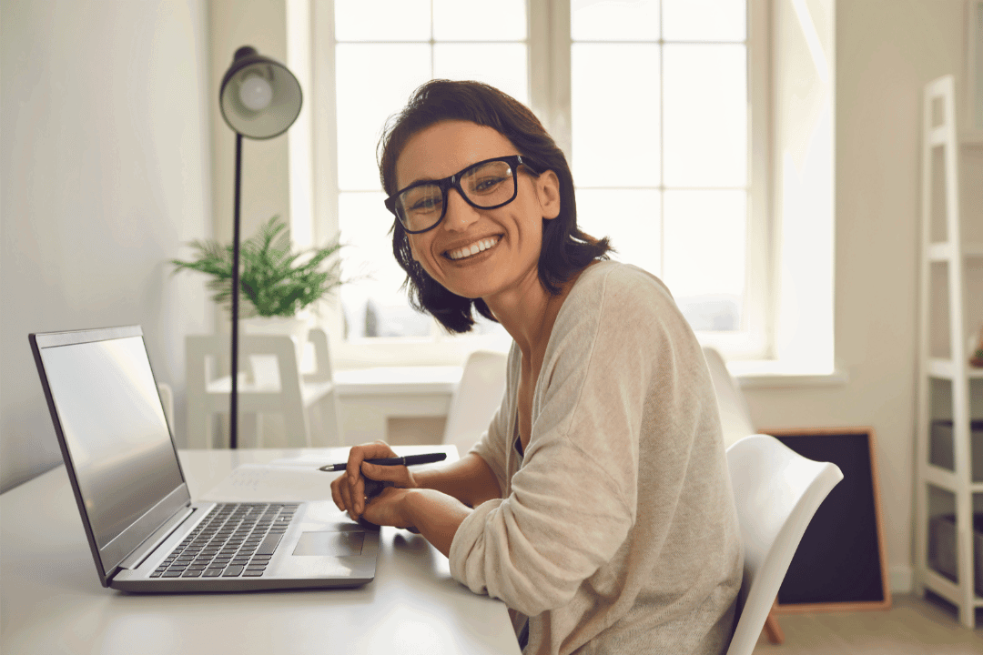 A remote customer service agent smiling at the camera